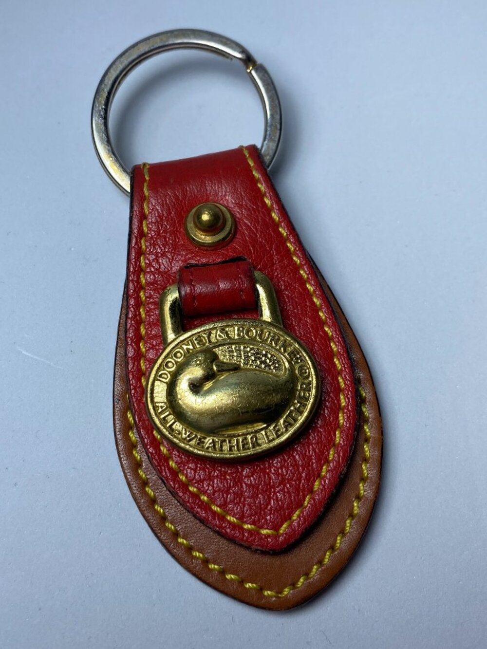 Vintage DOONEY & BOURKE AWL Leather Brass Duck Medallion Keychain Fob Red Tan